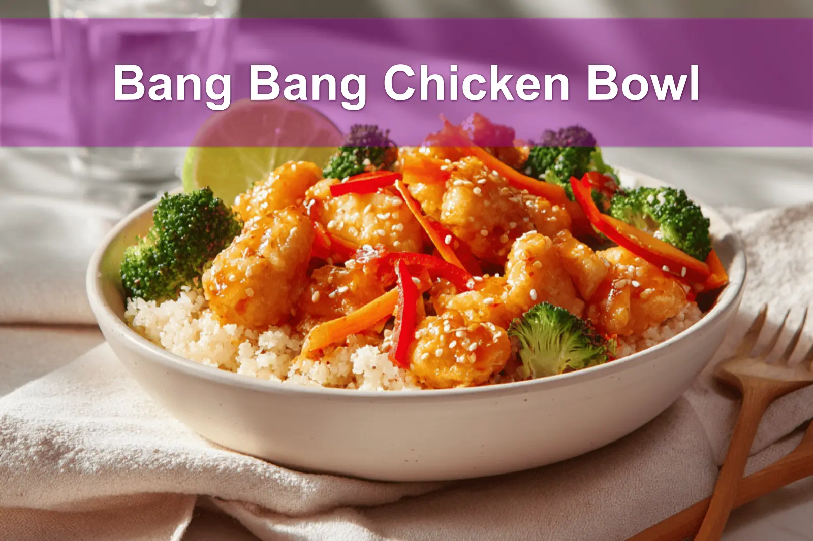 Bang Bang Chicken Bowl with tender-cooked chicken pieces rice cauliflower rice vegetables zesty creamy sauce lime