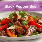 Black Pepper Beef dish with colorful peppers and glass of water