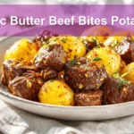 Garlic Butter Beef Bites Potatoes plated with roasted baby potatoes and garlic butter glaze