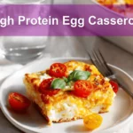High Protein Egg Casserole golden baked with cherry tomatoes and basil in warm natural light