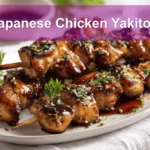 Japanese Chicken Yakitori Recipe for Authentic Grilled Flavor 5 Japanese Chicken Yakitori skewers on a white napkin with rich glaze and natural lighting.