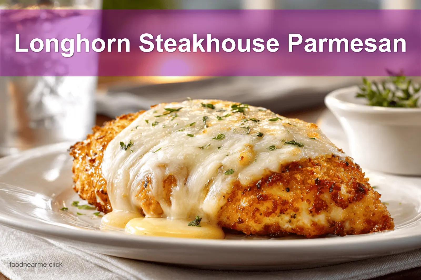 Longhorn Steakhouse Parmesan Chicken on a white napkin with water near it.