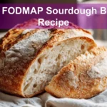 Low FODMAP Sourdough Bread Recipe finished loaf on white napkin and glass of water