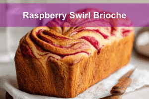Golden Raspberry Swirl Brioche loaf with vibrant raspberry swirls