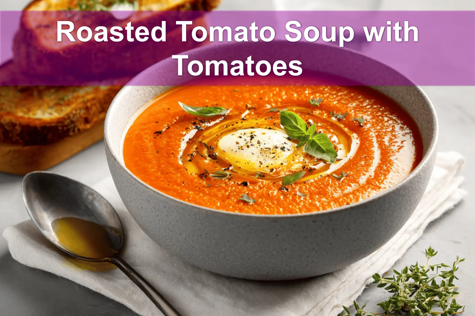 Roasted Tomato Soup with Tomatoes in bowl with grilled cheese basil under warm natural light