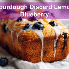 Moist sourdough discard lemon blueberry quick bread with a citrus glaze.