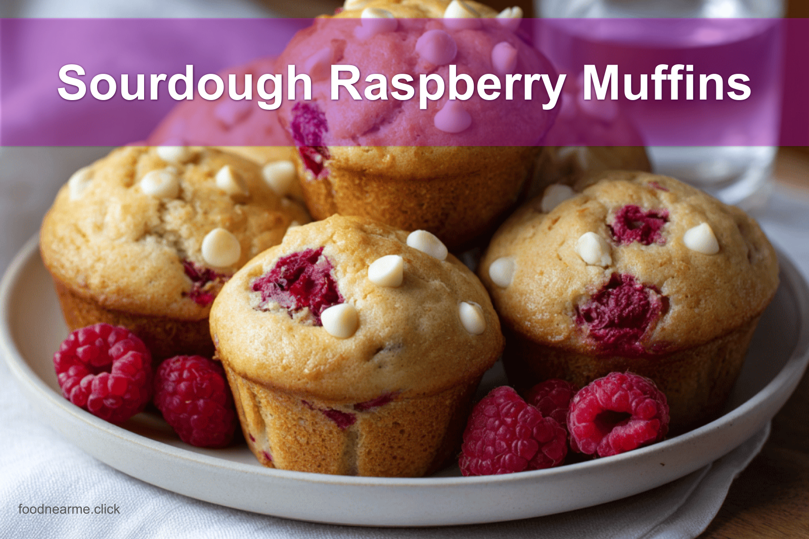 Sourdough Raspberry Muffins served with clear water and warm natural light for fresh gourmet appeal.