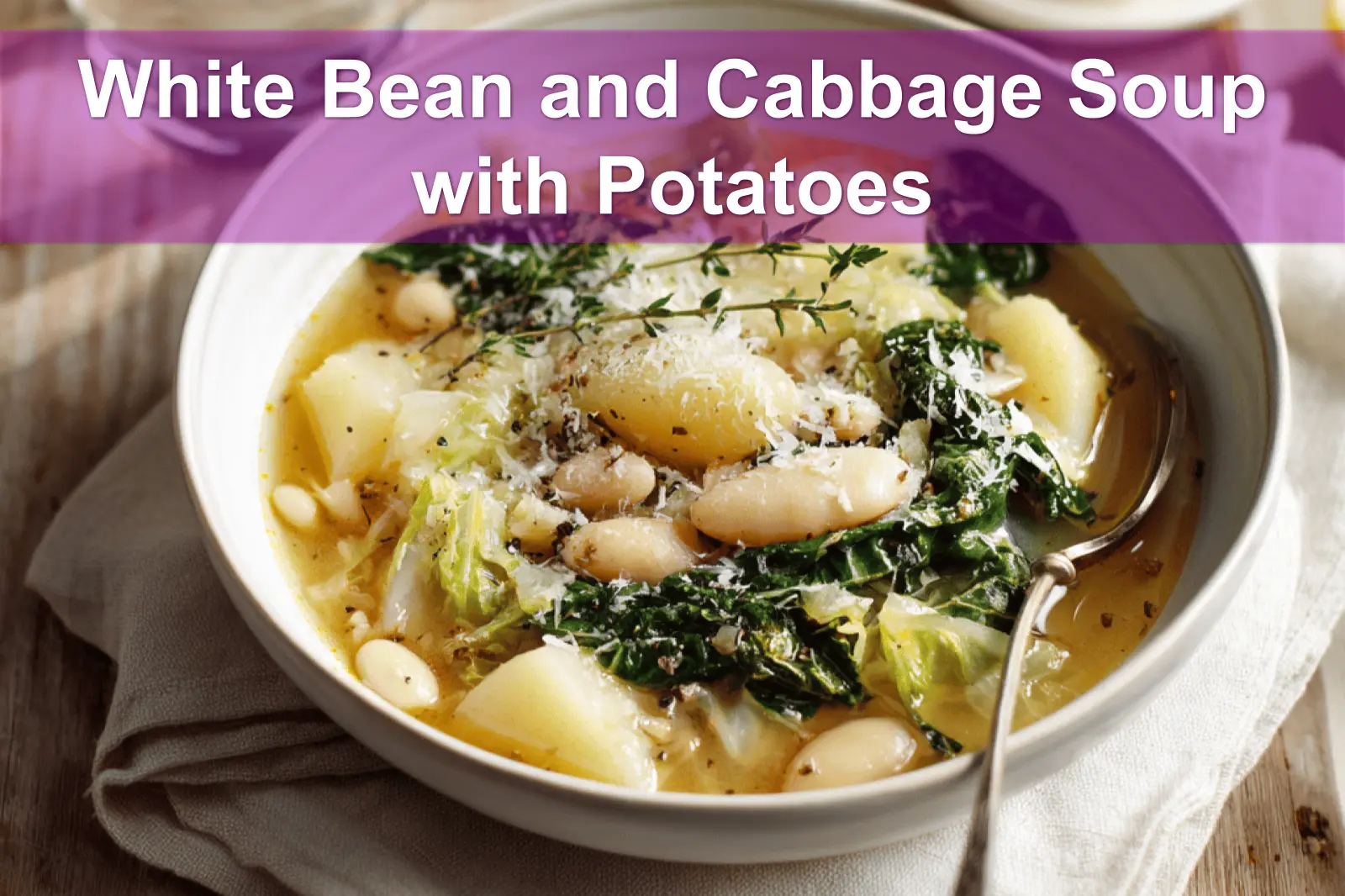 White Bean and Cabbage Soup with Potatoes in rustic bowl garnished with thyme and grated cheese