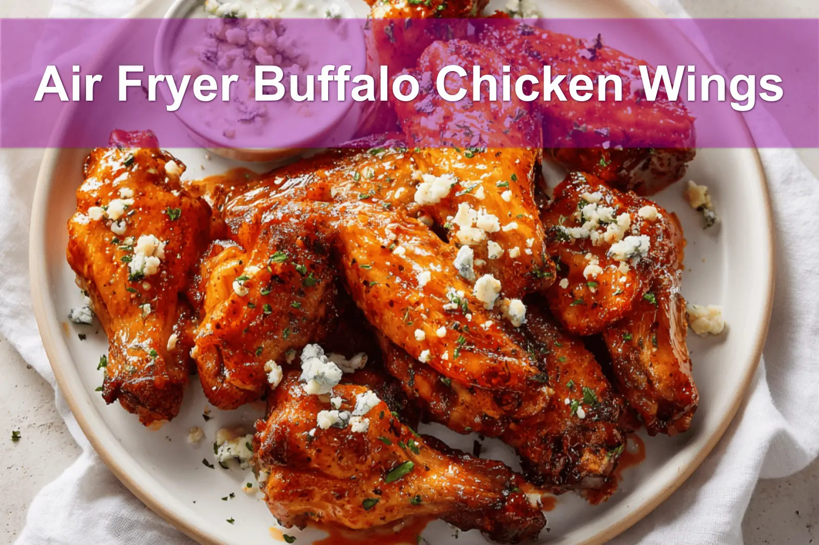 Air Fryer Buffalo Chicken Wings on white napkin with blue cheese dressing and water