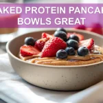 BAKED PROTEIN PANCAKE BOWLS GREAT finished bowl with berries peanut butter chocolate chips and syrup