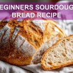 BEGINNERS SOURDOUGH BREAD RECIPE warm crusted scored loaf on white cloth with water
