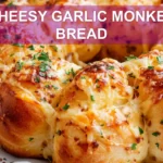 CHEESY GARLIC MONKEY BREAD golden pull apart rolls with melted cheese and fresh herbs