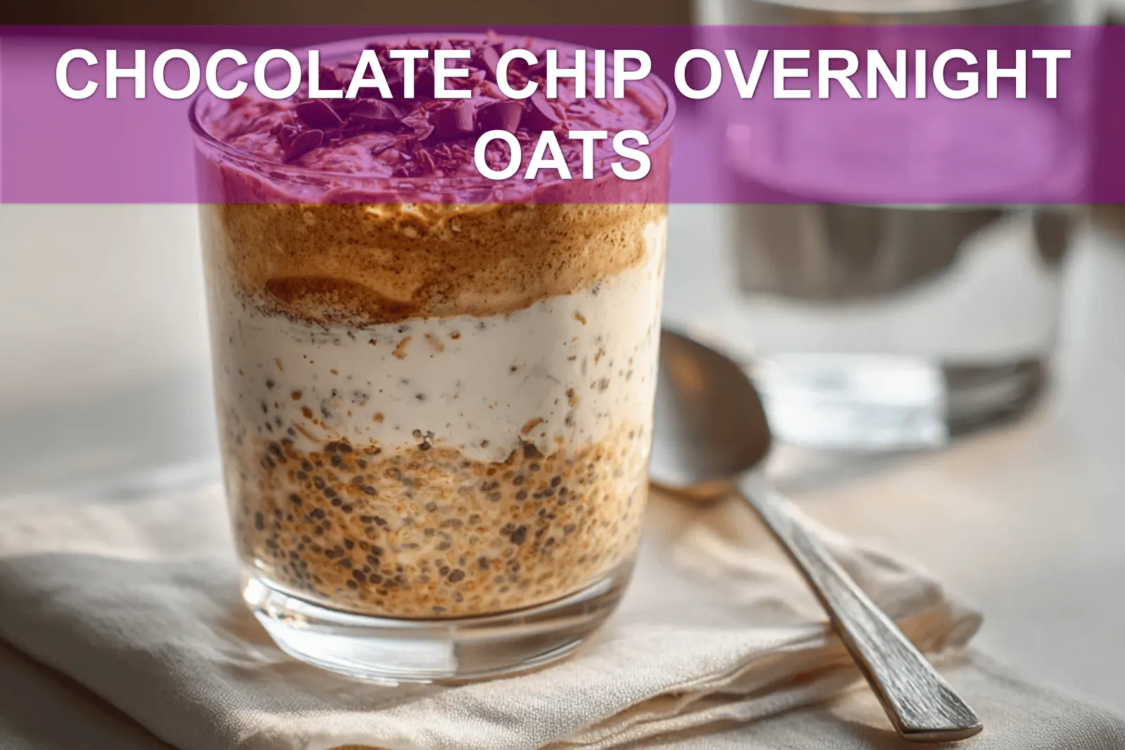 CHOCOLATE CHIP OVERNIGHT OATS creamy jar topped with vegan chips in warm natural light