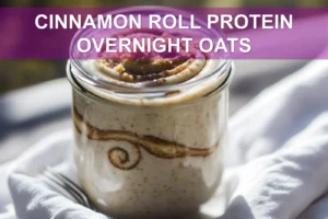 Cinnamon Roll Protein Overnight Oats: Simple and Delicious Recipe CINNAMON ROLL PROTEIN OVERNIGHT OATS jar with cinnamon swirl on white napkin beside water