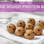 COOKIE DOUGH PROTEIN BALLS single bowl on white cloth warm natural light shallow depth of field
