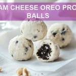 CREAM CHEESE OREO PROTEIN BALLS close up on white napkin warm natural light