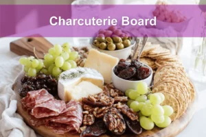 Charcuterie Board with brie prosciutto grapes figs crackers on warm styled table