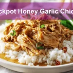 Crockpot Honey Garlic Chicken plated with rice green beans and sticky honey garlic glaze