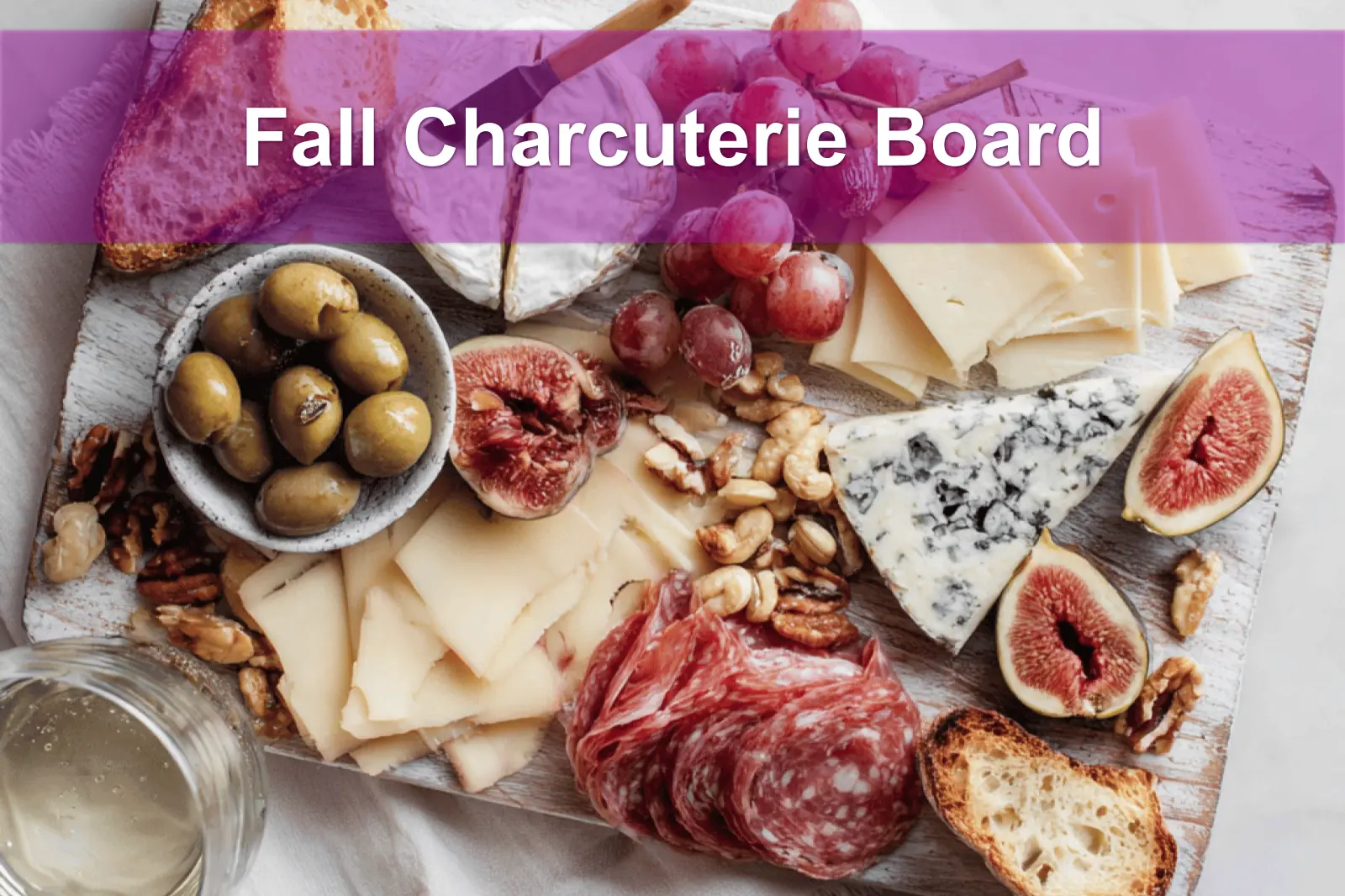 Fall Charcuterie Board with brie cheddar gouda blue cheese prosciutto salami fruit and nuts