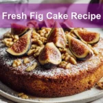 Fresh Fig Cake Recipe topped with sliced figs and powdered sugar, warm golden crumb