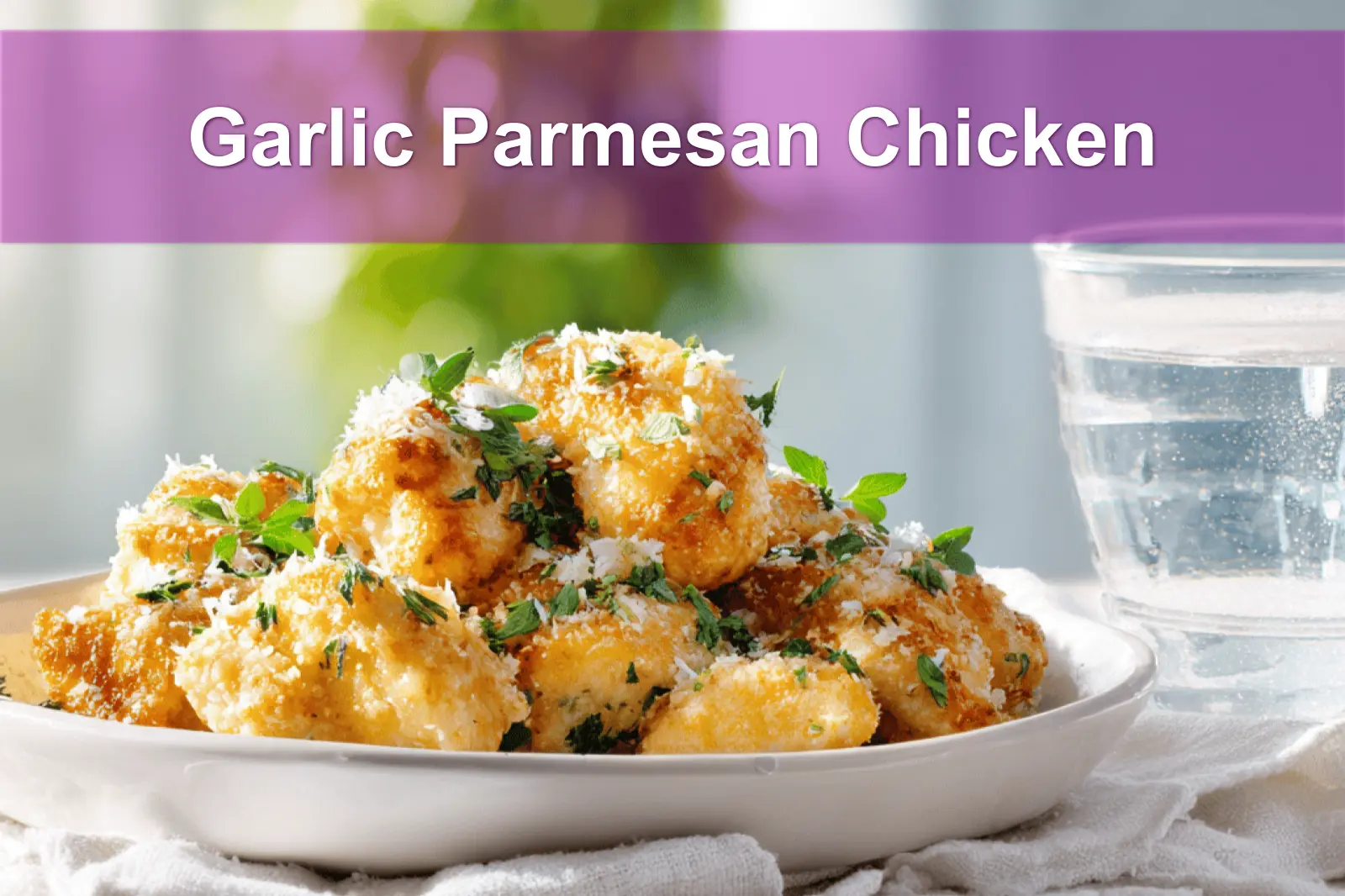 Garlic Parmesan Chicken plated with golden crust fresh herbs and grated cheese on white napkin