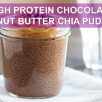 HIGH PROTEIN CHOCOLATE PEANUT BUTTER CHIA PUDDING creamy layered pudding in glass jar warm tones