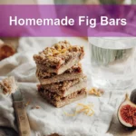Homemade Fig Bars golden oat crust with fig jam filling styled on white cloth beside water
