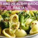 LIGHT AND HEALTHY BROCCOLI PASTA plated with broccoli florets garlic and grated cheese warm natural light