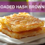 LOADED HASH BROWNS with avocado scrambled eggs cottage cheese and everything bagel seasoning on napkin