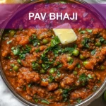 PAV BHAJI hero bowl with buttered pav herbs lime wedge and glass of water