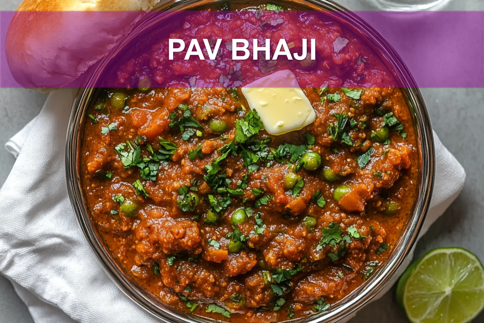 PAV BHAJI hero bowl with buttered pav herbs lime wedge and glass of water