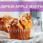 PUMPKIN APPLE MUFFINS hero shot three quarter angle warm tones on white cloth