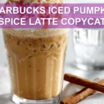Starbucks Iced Pumpkin Spice Latte Copycat: Easy Delicious Recipe 7 STARBUCKS ICED PUMPKIN SPICE LATTE COPYCAT glass with whipped topping cinnamon and caramel drizzle