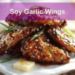 Soy Garlic Wings plated on white napkin with sesame seeds and green onions