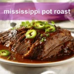 mississippi pot roast on white napkin with buttery glaze and clear glass of water