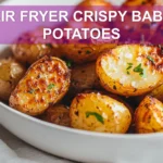 AIR FRYER CRISPY BABY POTATOES golden crispy baby potatoes plated with herbs and sea salt flakes