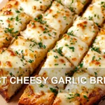 BEST CHEESY GARLIC BREAD centered hero view, clean and uncluttered