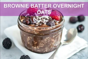 Brownie Batter Overnight Oats: Easy Delicious Breakfast BROWNIE BATTER OVERNIGHT OATS creamy chocolate oats topped with berries dates dark chocolate and coconut flakes