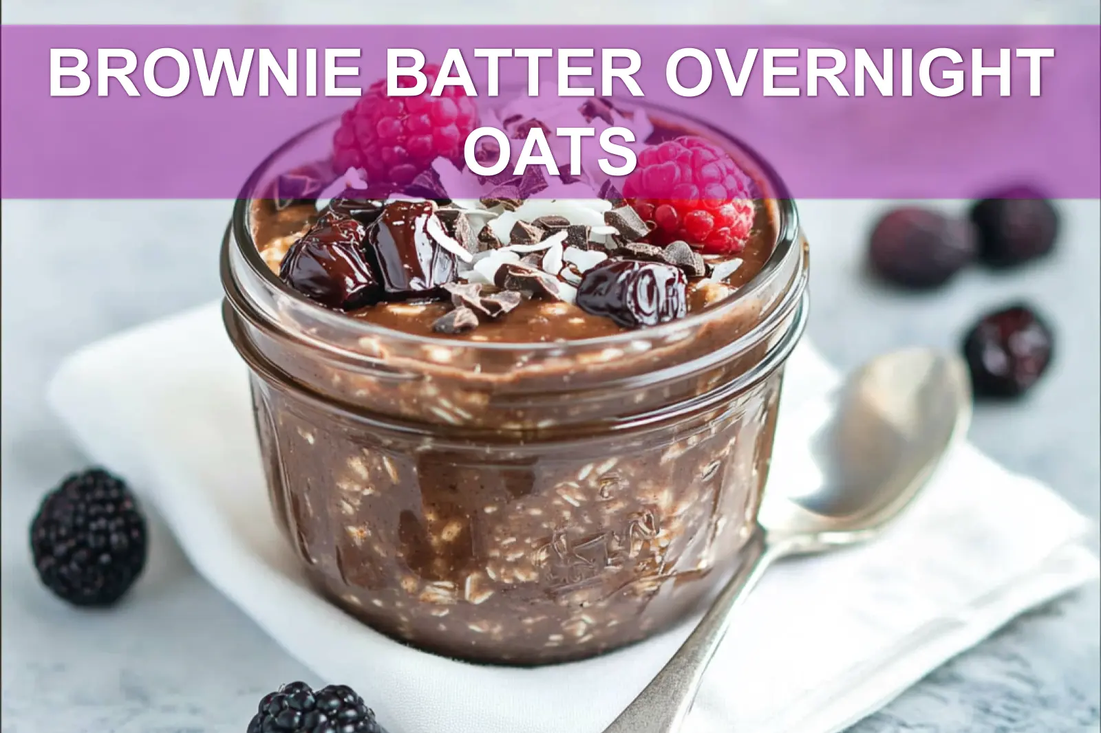 BROWNIE BATTER OVERNIGHT OATS creamy chocolate oats topped with berries dates dark chocolate and coconut flakes