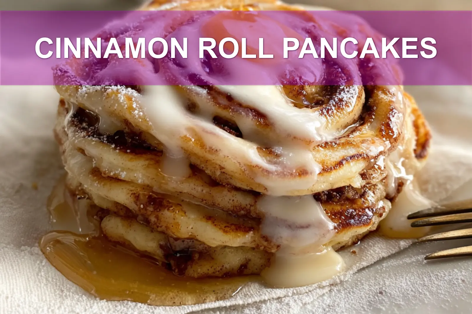CINNAMON ROLL PANCAKES stacked with maple syrup and delicate white cheese glaze on white cloth