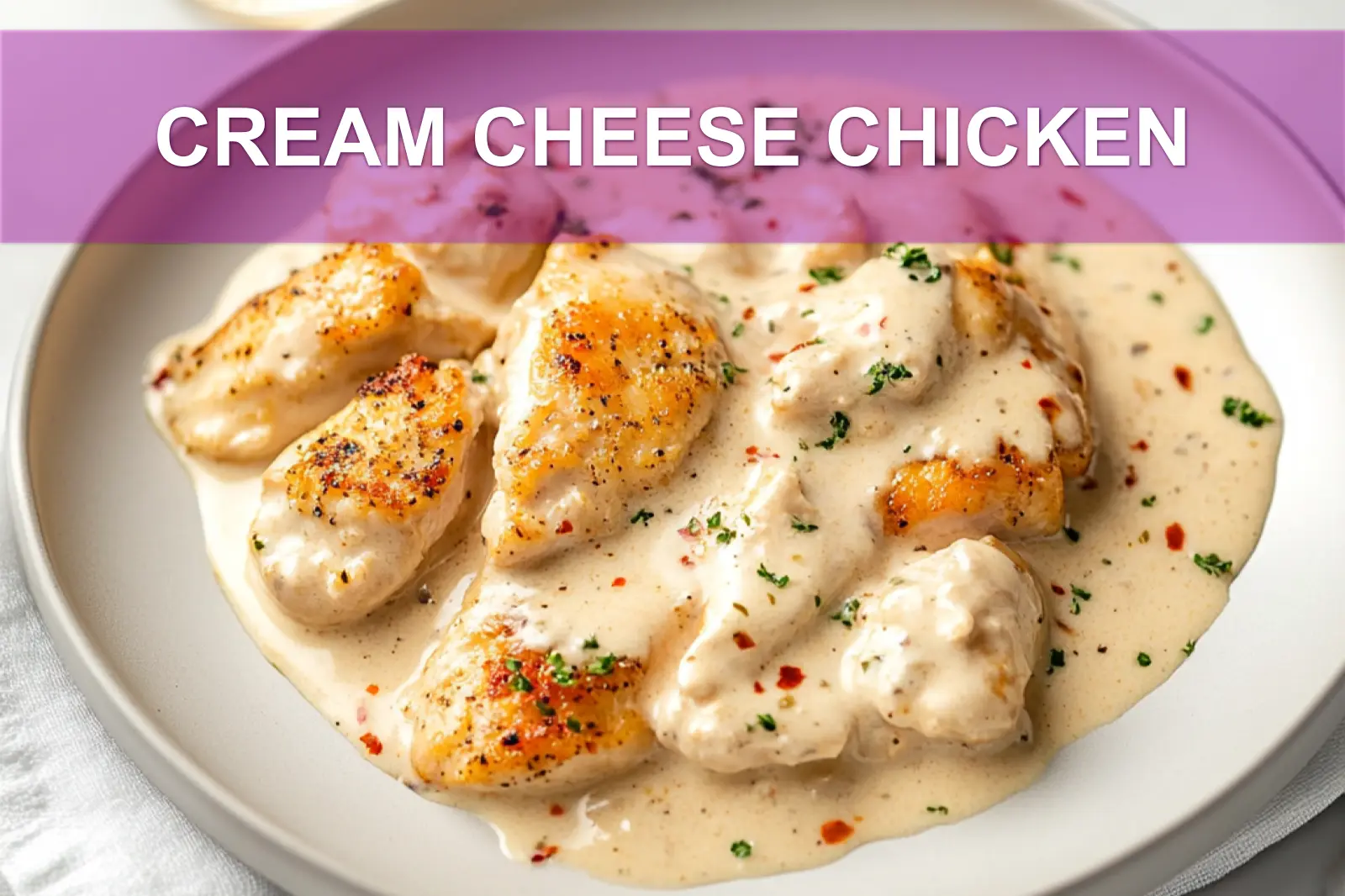 CREAM CHEESE CHICKEN plated with delicate white cheese garlic and fresh herbs in warm natural light close up