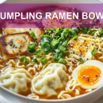 DUMPLING RAMEN BOWL with dumplings ramen eggs spinach green onions black sesame seeds