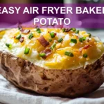 EASY AIR FRYER BAKED POTATO with melted butter chives cheese and bacon on white napkin