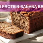 HIGH PROTEIN BANANA BREAD hero loaf on white cloth warm natural light shallow depth