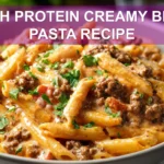 HIGH PROTEIN CREAMY BEEF PASTA RECIPE plated penne with ground beef creamy yogurt sauce fresh herbs