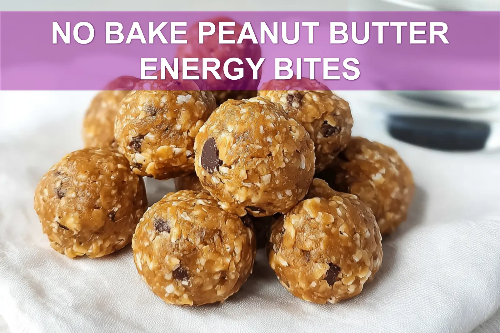 NO BAKE PEANUT BUTTER ENERGY BITES on white napkin with clear glass of water warm light