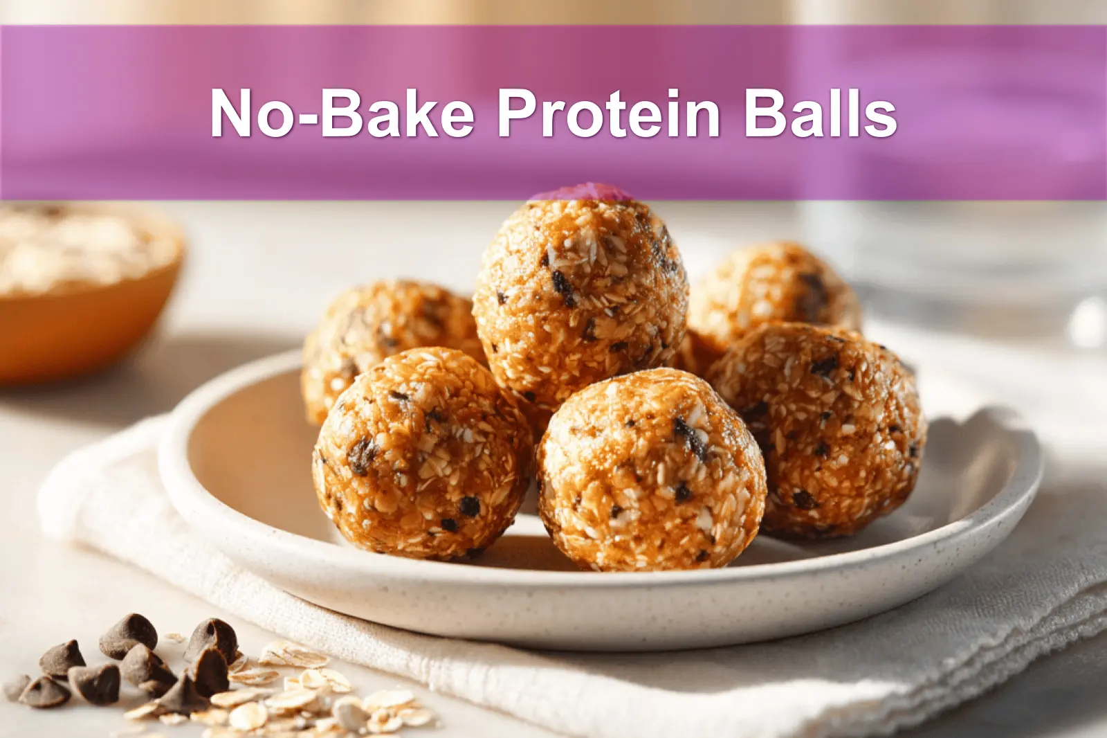 NO BAKE PROTEIN BALLS on white cloth with glass of water warm natural light