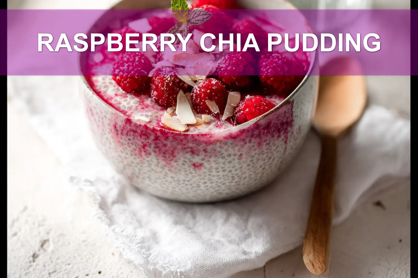 RASPBERRY CHIA PUDDING topped with raspberries sliced almonds coconut flakes maple syrup and mint