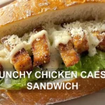 CRUNCHY CHICKEN CAESAR SANDWICH centered hero view, clean and uncluttered