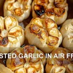 ROASTED GARLIC IN AIR FRYER centered hero view, clean and uncluttered